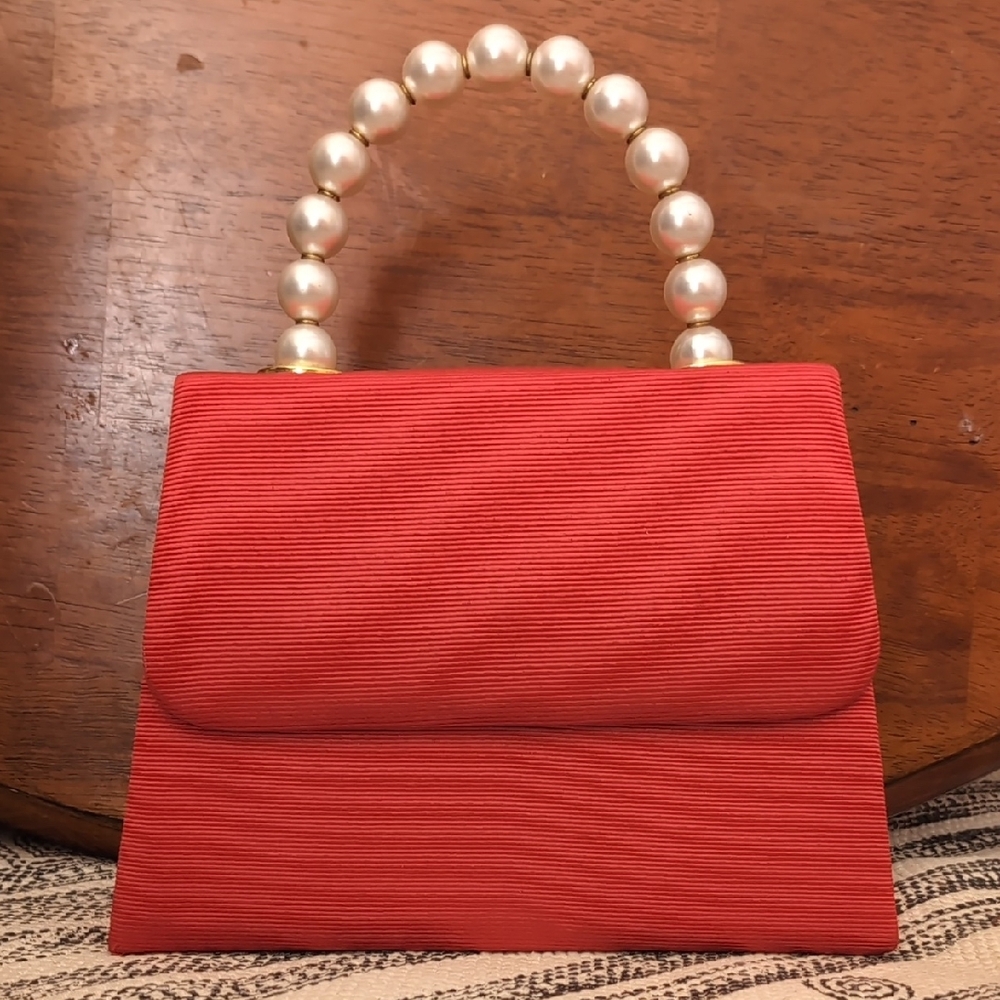 Elegant Red Handbag with Pearl Handle